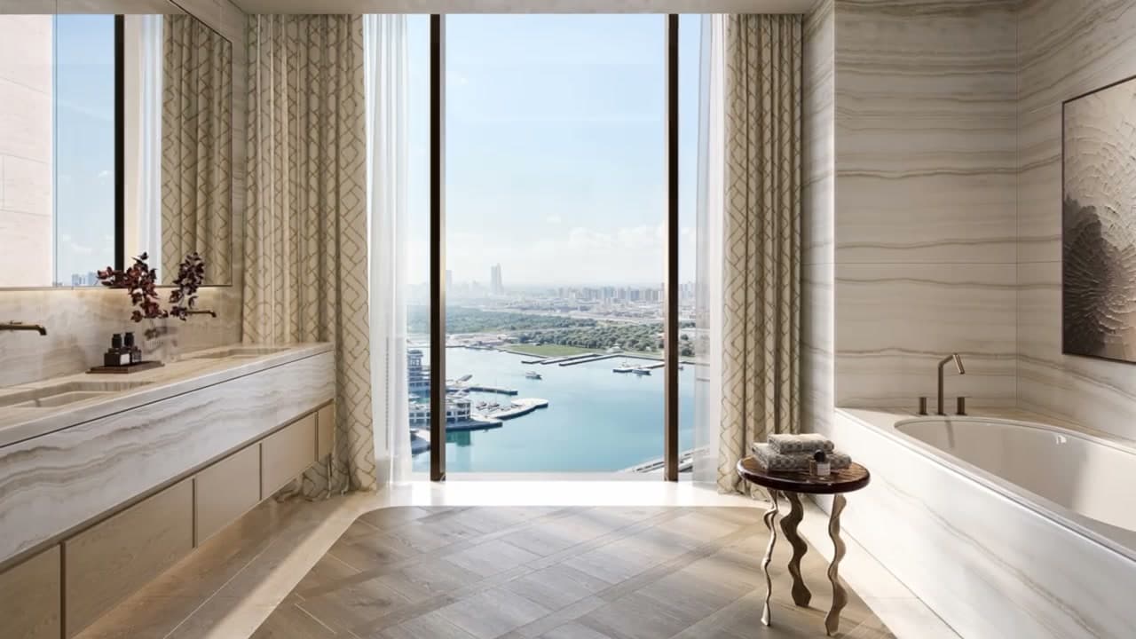 A bathroom with a view over the water